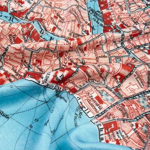 Detail of the vintage Venice map print silk scarf in red.