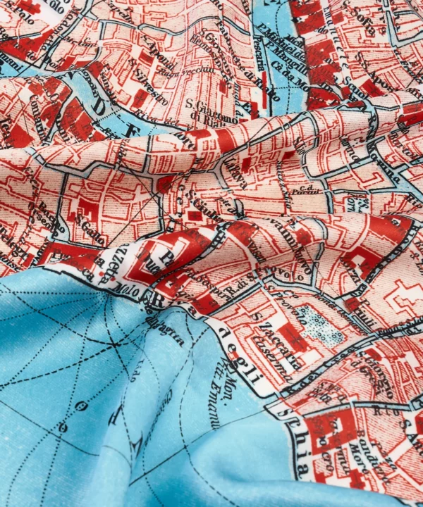 Detail of the vintage Venice map print silk scarf in red.