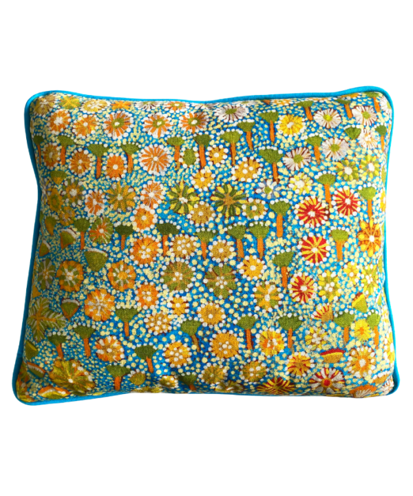 Lumbar mini-cushion with colourful, botanical, Aboriginal art print in Spring green with turquoise trim.