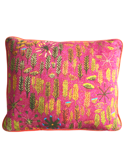 Lumbar mini-cushion with colourful, botanical, Aboriginal art print in pink with orange trim.