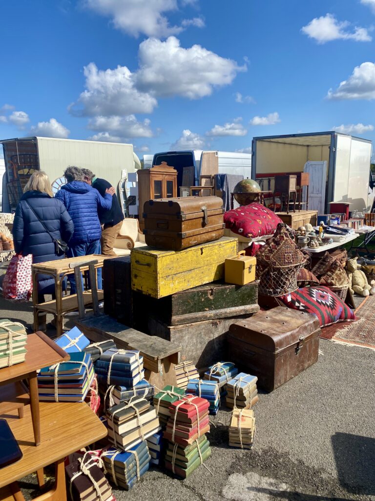 A view across Sunbury antiques fair at Kempton Racecourse on a sunny morning.