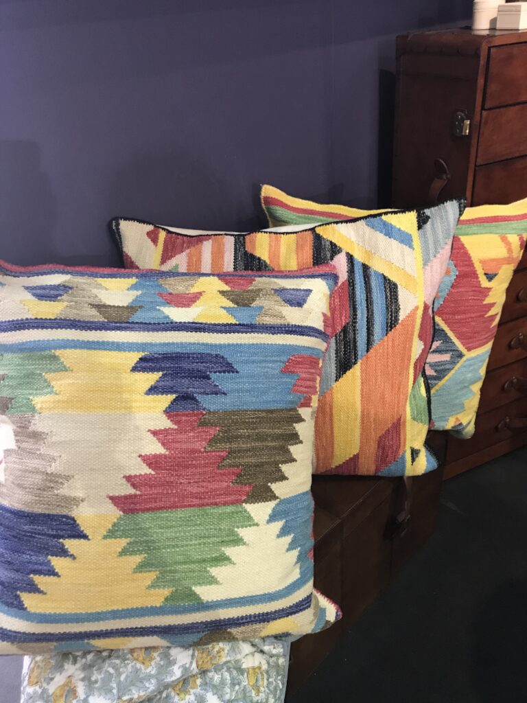 Cushions made up using colourful, kilim flat wovens.