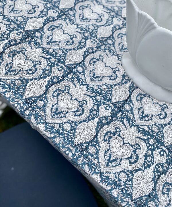 A close-up shot of a Mughal-style Indian block print tablecloth.