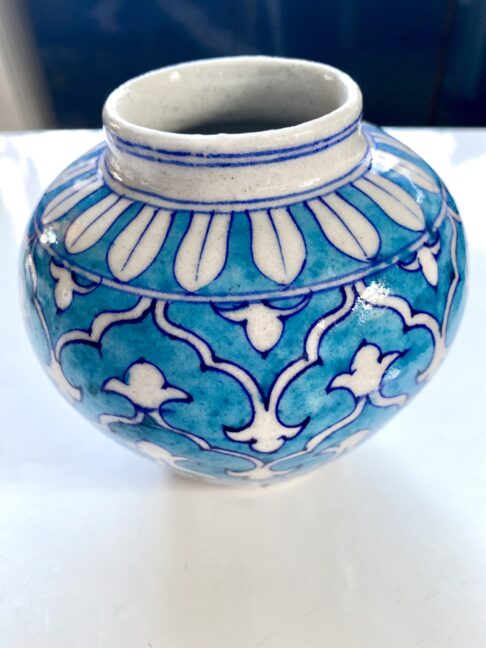 A pretty vase in blues with an intricate, Mughal-style pattern.