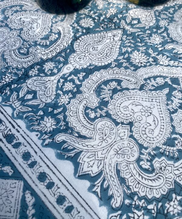 Block print tablecloth in blue with an Indian, Mughal-style paisley motif.