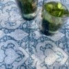 A summer tablecloth in blue with a chic, Mughal-style Indian block print paisley pattern.