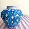 A pretty, small turquoise patterned vase with Indian-style painted décor.