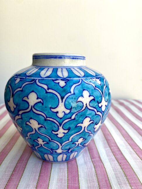 A pretty, small turquoise patterned vase with Indian-style painted décor.