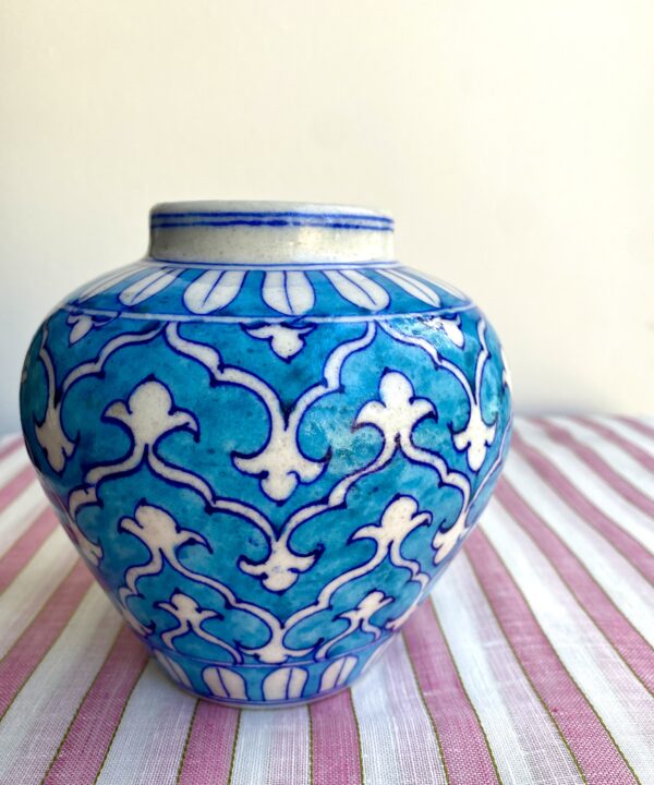 A pretty, small turquoise patterned vase with Indian-style painted décor.