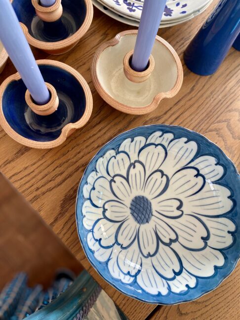 Blue and white Japanese bowl with flower detail and scalloped edges.