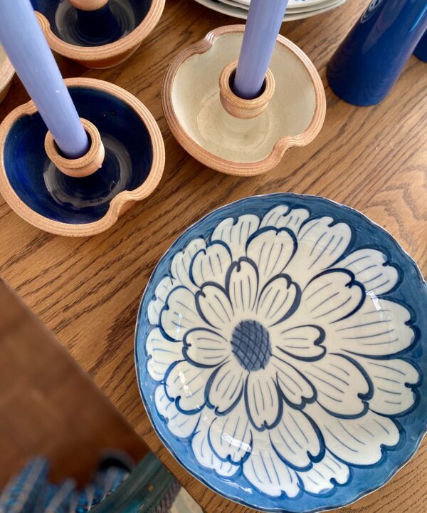 Blue and white Japanese bowl with flower detail and scalloped edges.