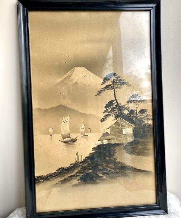 Vintage Japanese landscape art with gold accents and framed in black.