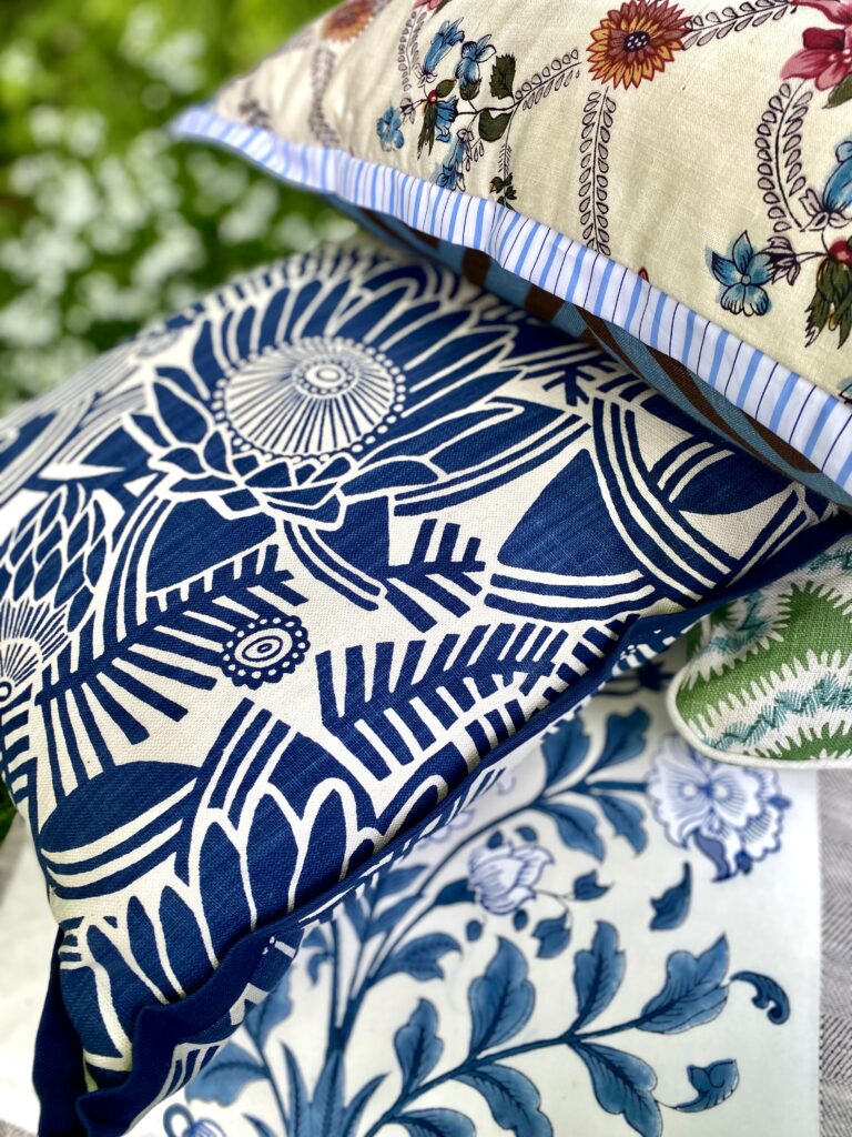 A selection of handmade cushions featuring silks, hand-printed linens and block-printed cotton available through Designs By Origin.