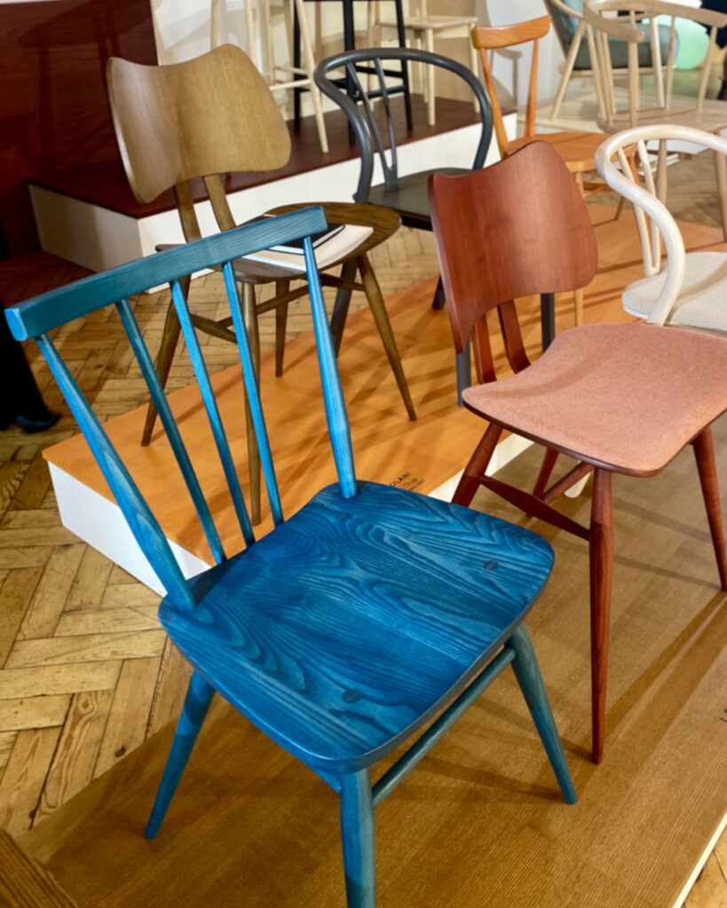 A stylish. blue woodgrain, stick back dining chair by Ercol, amongst others.