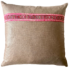 A vintage embroidery trim in pink on a taupe glazed and brushed linen cushion.