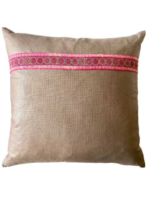 A vintage embroidery trim in pink on a taupe glazed and brushed linen cushion.