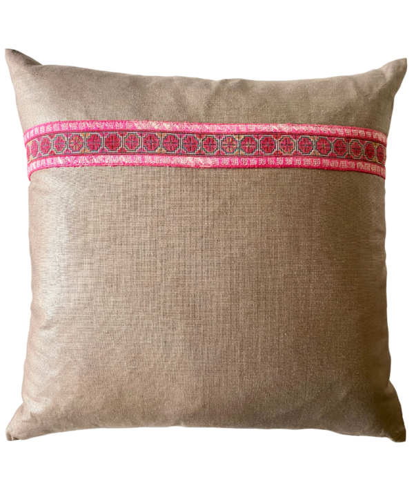 A vintage embroidery trim in pink on a taupe glazed and brushed linen cushion.