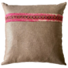 A pink and taupe vintage embroidery cushion.