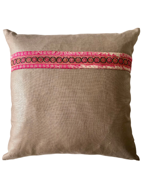 A pink and taupe vintage embroidery cushion.