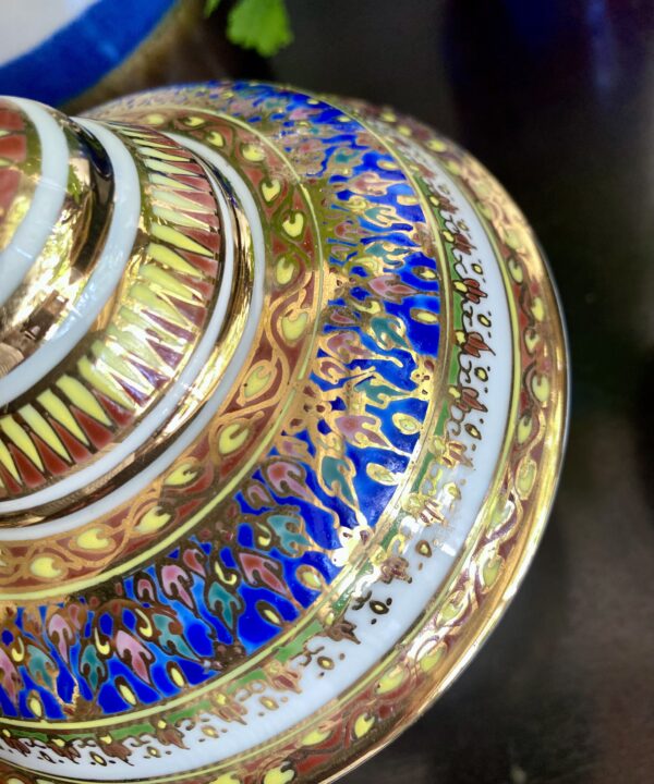 Close-up of a hand-decorated Benjarong pot handmade in Thailand.