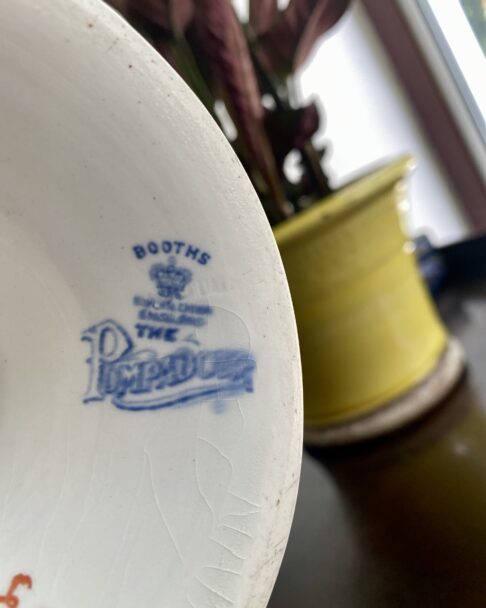 The Booths back stamp on a vintage Booths cake stand.