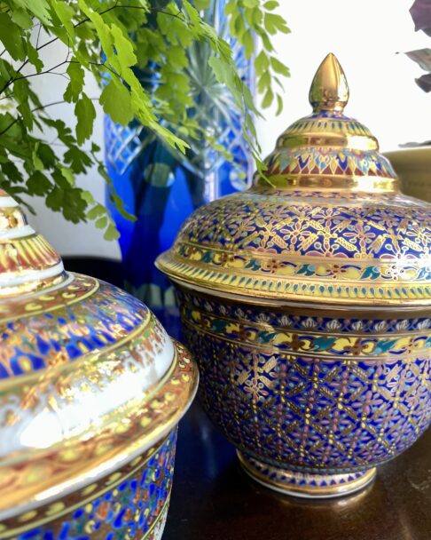 Colourful blue and gold pots from Thailand with gold finial lids.