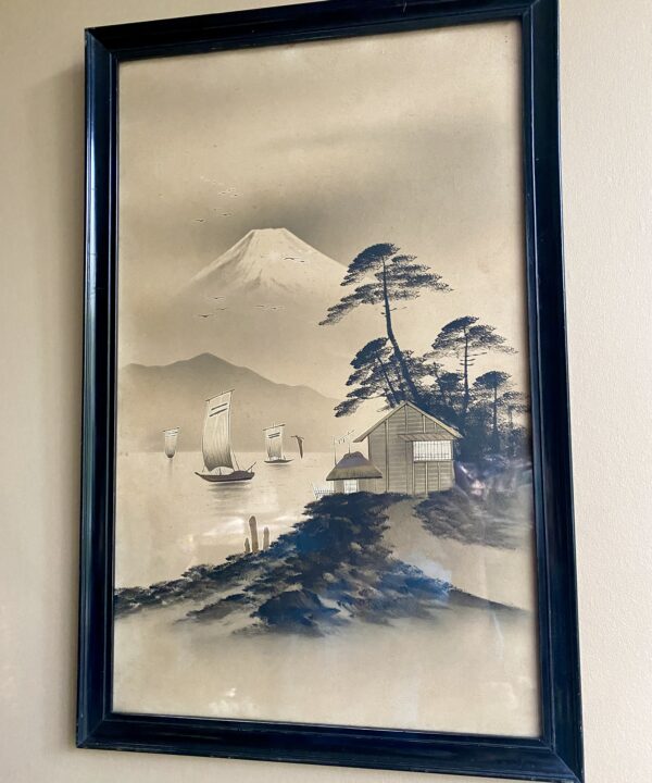 A vintage Asian - probably Japanese - landscape print in warm beige with gold accents.