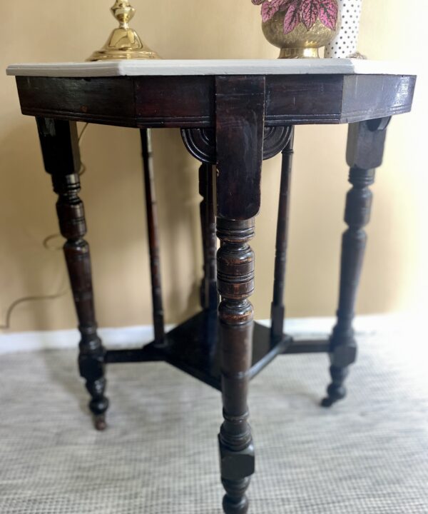 An antique, Edwardian side table on castors with a newly painted, octagonal top.