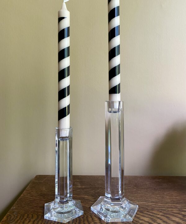 A pair of vintage crystal candlesticks styled with stripy black and beige candlesticks.