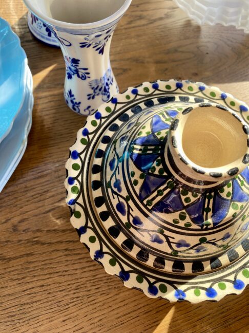 An overhead view of a hand-painted Moroccan lidded pot or decorative miniature tagine.