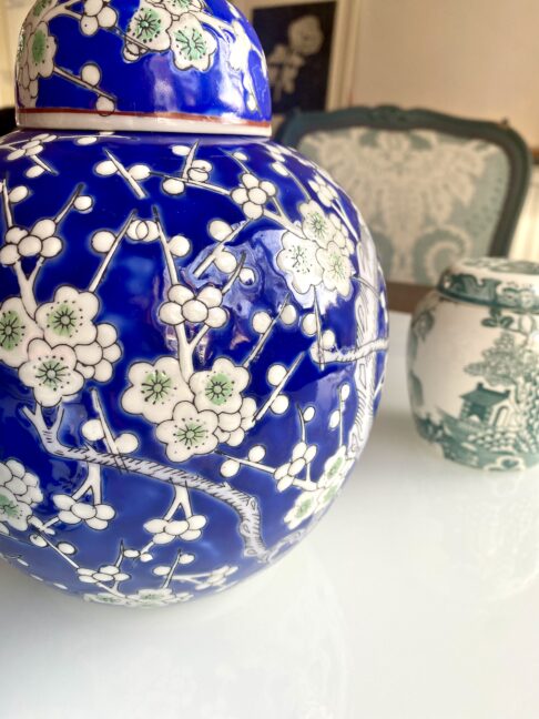 Blossom detail on a blue and white ginger jar.