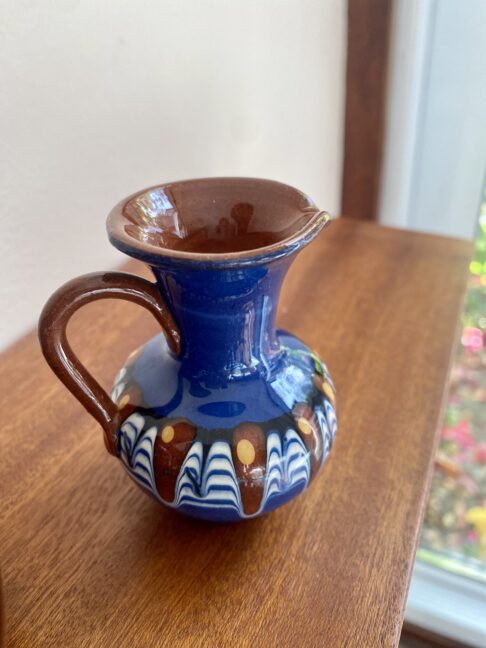 A diminutive, earthy-hued glazed clay jug from Bulgaria.