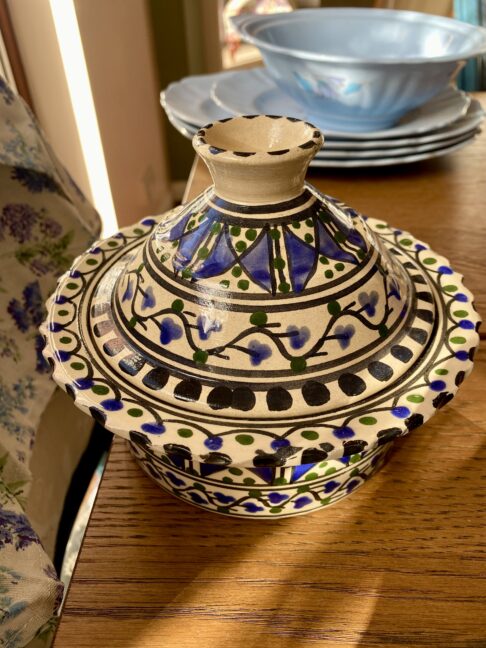 A tagine-style, decorative pot with a funnel-shaped lid.