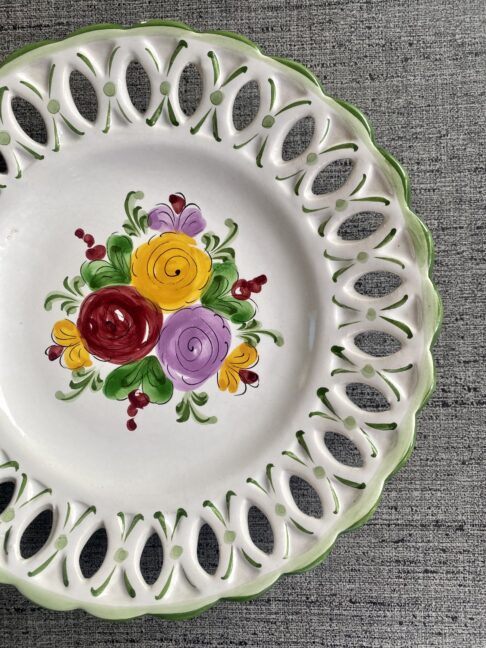 A reticulated edge plate with hand-painted florals.