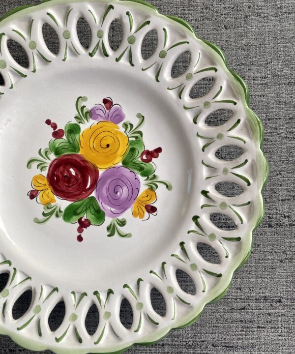 A reticulated edge plate with hand-painted florals.