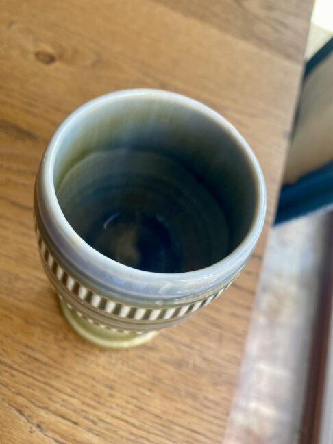 Overhead shot of a handmade, vintage pottery goblet from Ireland.