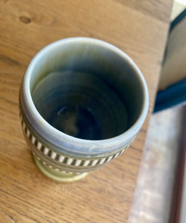 Overhead shot of a handmade, vintage pottery goblet from Ireland.