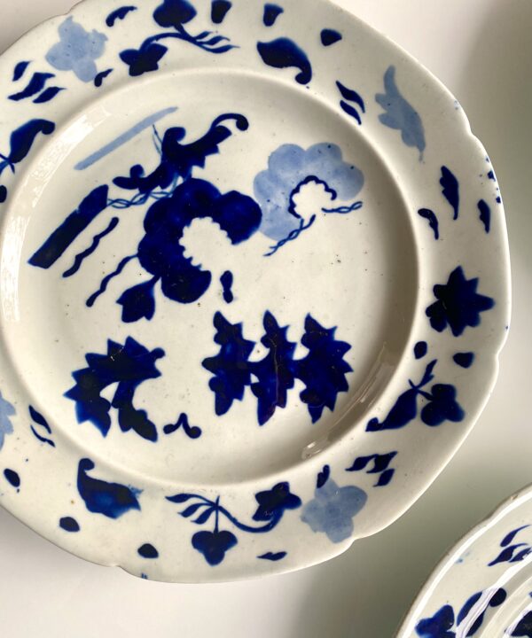 Decorative wall plates in indigo blue and white.