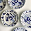 A set of decorative wall plates in blue and white, handmade in Staffordshire pearlware in the 19th century.