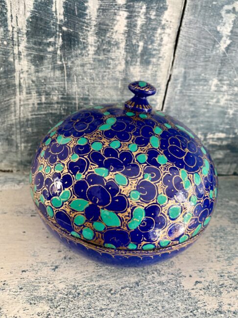 Overhead view of a pretty Indian trinket pot with a lid in blue and green. Vintage and hand-painted.