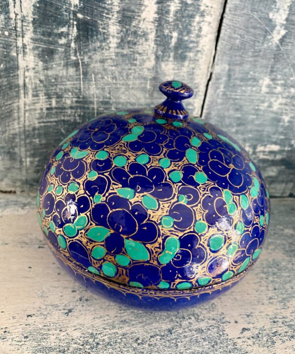 Overhead view of a pretty Indian trinket pot with a lid in blue and green. Vintage and hand-painted.