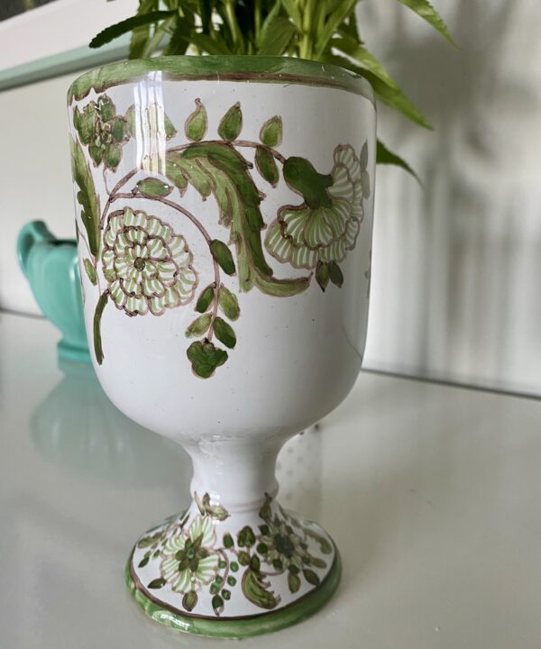 A footed vase handmade in Portugal with floral hand-painted decoration.