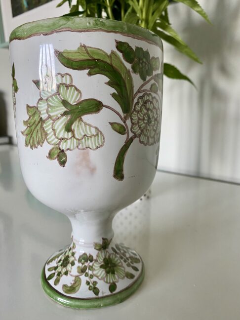 A green floral vase from Portugal.