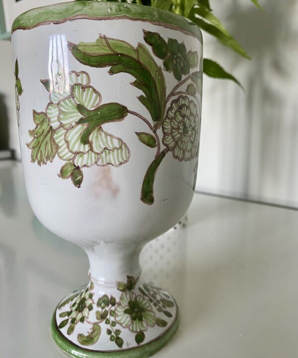 A green floral vase from Portugal.