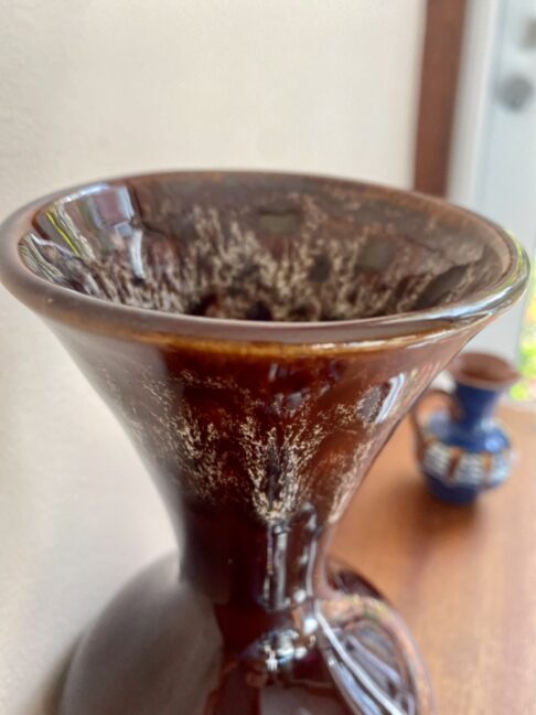 Funnel-neck detail showing the honeycomb glaze on a retro 1970s brown vase.