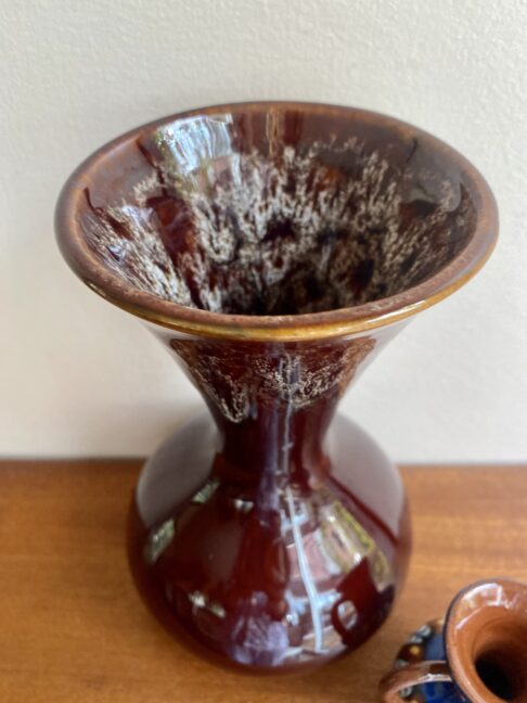 Honeycomb glaze detail on a brown, handmade. funnel-neck vase dating from the 1970s.