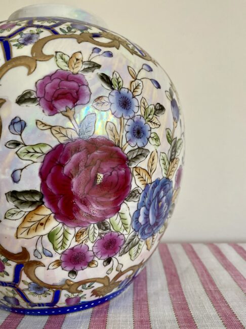 Hand-painted floral detail on a vintage Chinese vase.