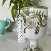 A pretty-floral-vase with hand-painted detail.