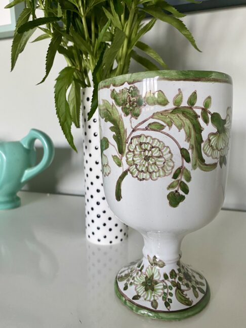 A pretty-floral-vase with hand-painted detail.