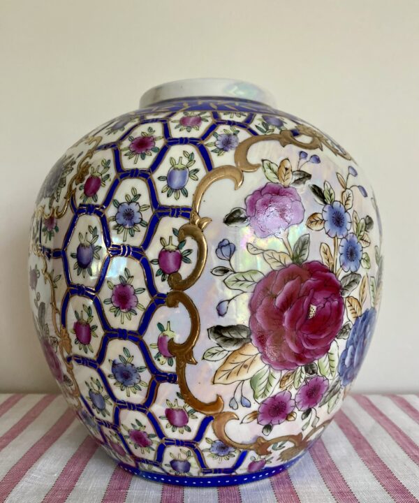 Vintage Chinese vase in pink with hand-painted rose design and florals with blue and gold-coloured accents.